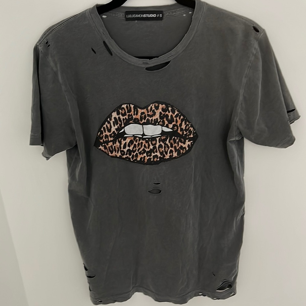 Grey tee. Looser fit.